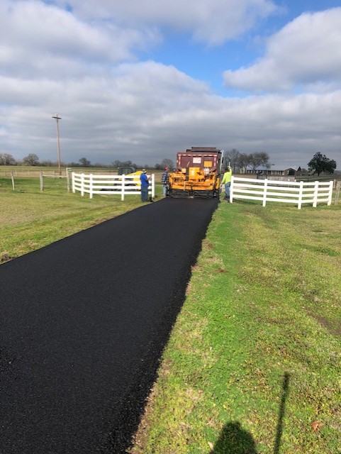 Residential-Driveway-paving Blacktop coated drive way done by Premium Asphalt Paving.